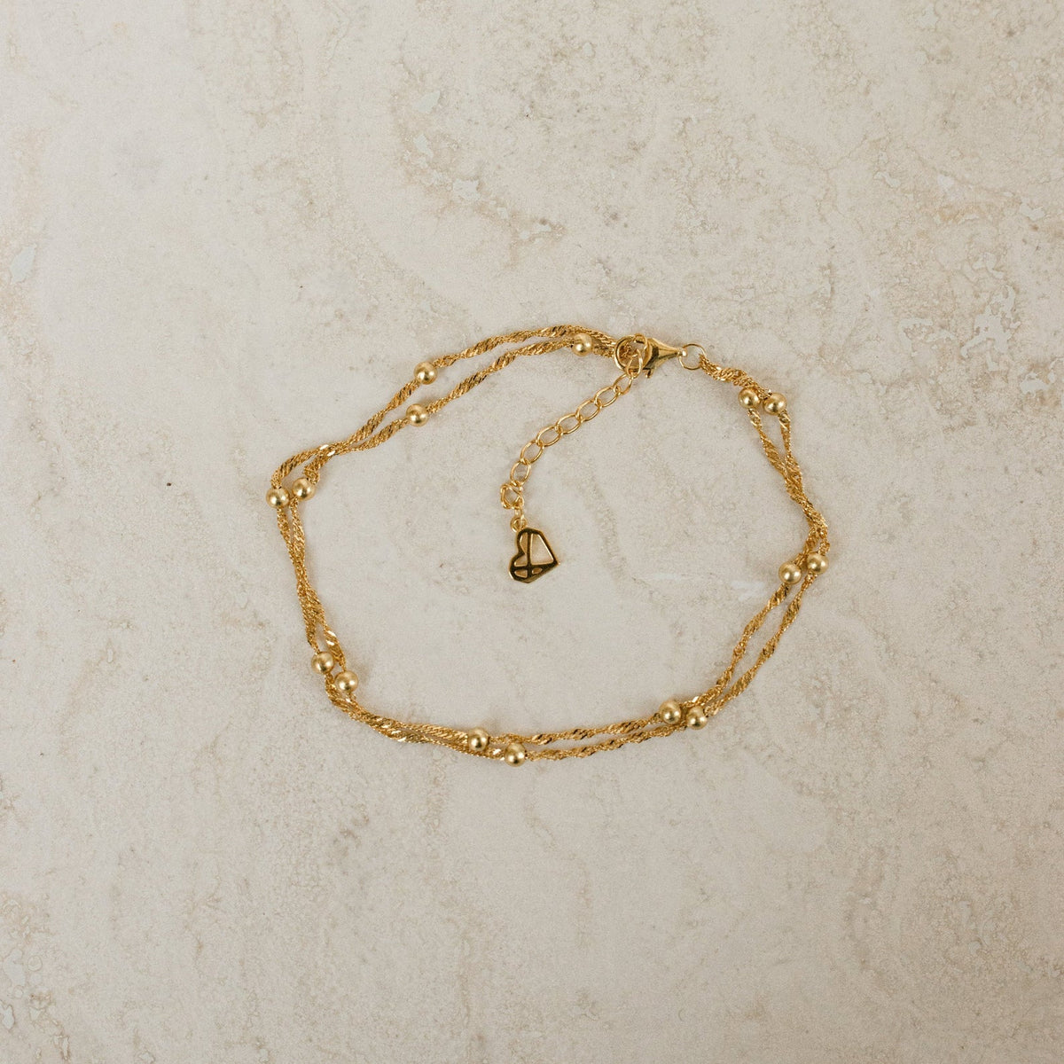 Tornozeleira com corrente de contas duplas