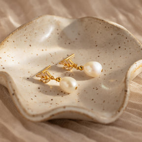 Brincos de pérola e diamante