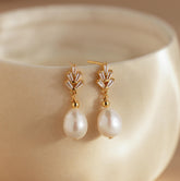 Brincos de pérola e diamante
